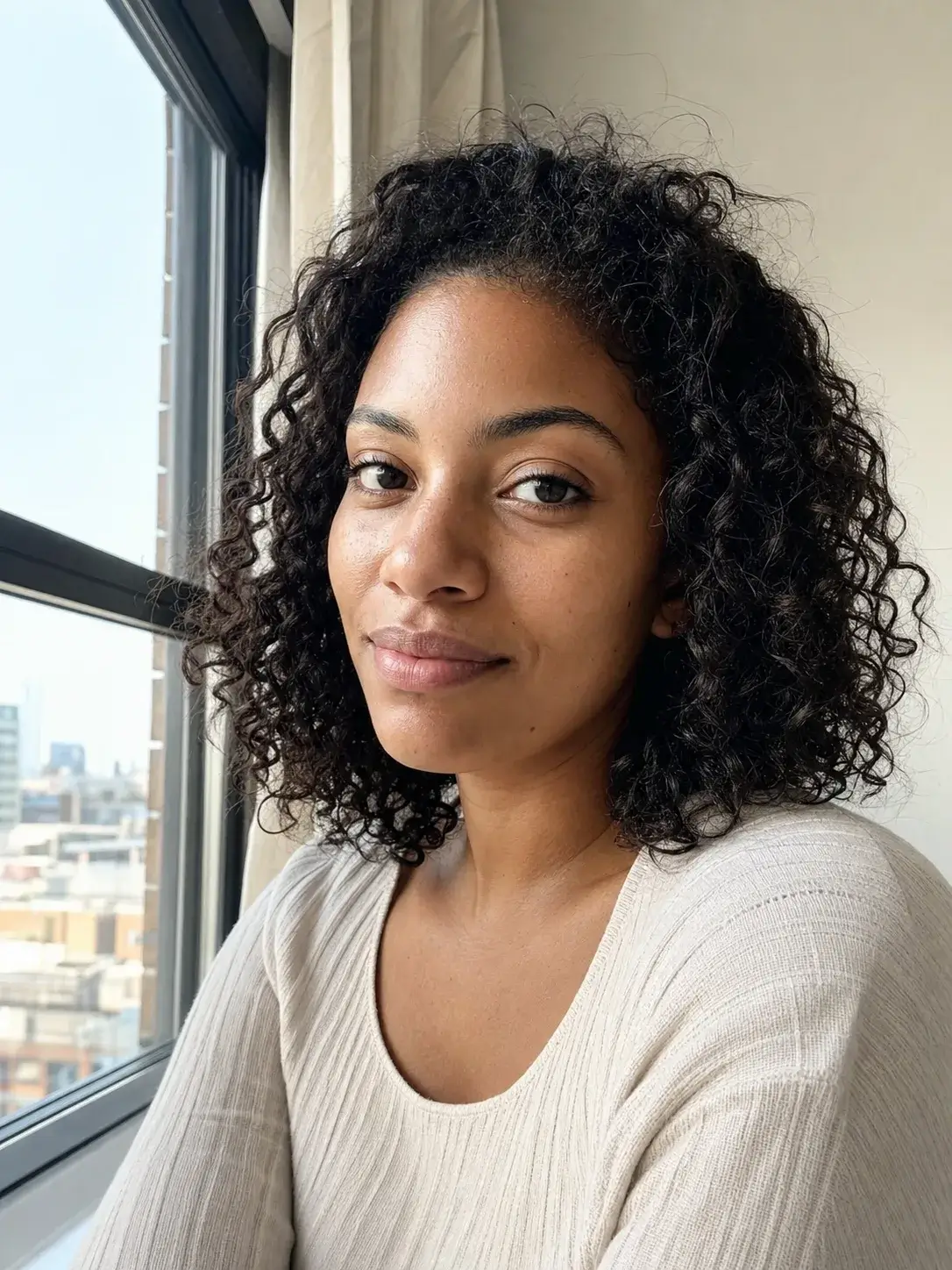 AI-generated synthetic adult woman beside an apartment window